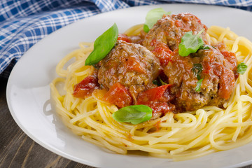 Pasta with meat, tomato sauce, vegetables.