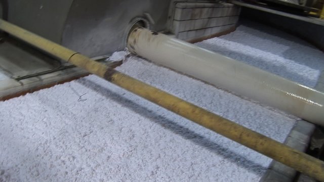 Cotton fiber pulp being processed by a beater
