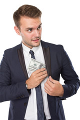 Businessman putting money into pocket