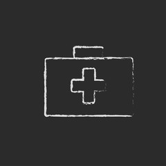 First aid kit icon drawn in chalk.