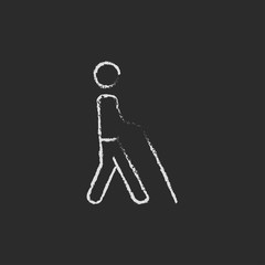 Blind man with stick icon drawn in chalk.