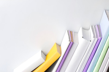 row of books on white background