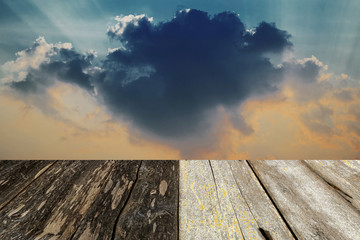 wood floor with dramatic sky background.