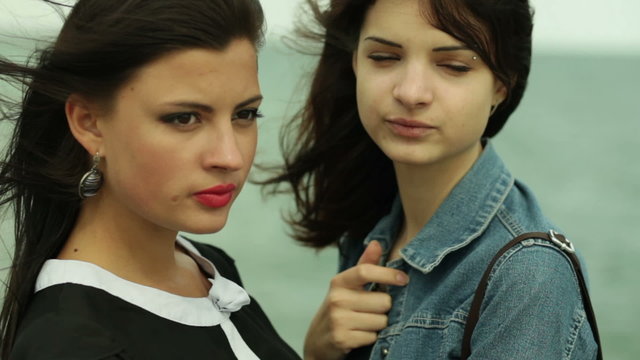 Two women on the background of the sea