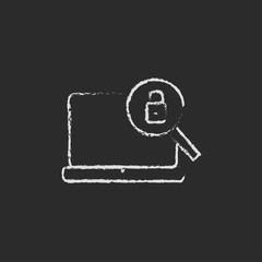 Laptop and magnifying glass icon drawn in chalk.