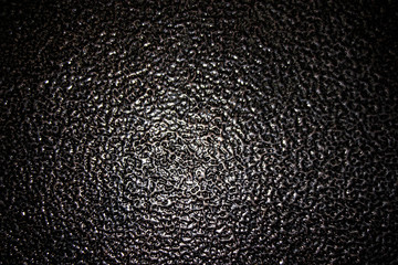 background black crude iron with a rough surface