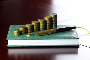 coin exchange rate glasses pen notebook