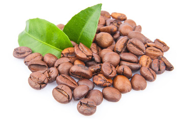 Coffee beans and green leaves