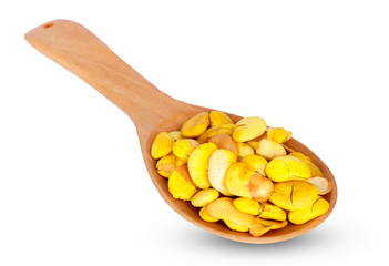 Nuts on wooden spoon isolated on white background.