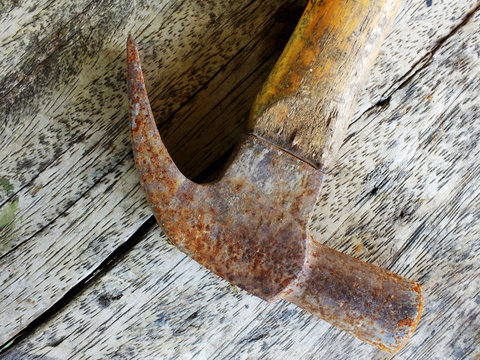 old rusted tools on wooden table