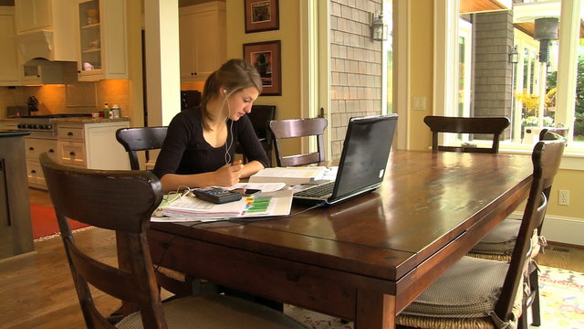 MWS HS student studying at dining table