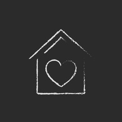 House with heart symbol icon drawn in chalk.