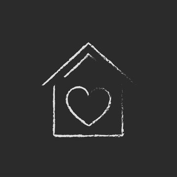 House with heart symbol icon drawn in chalk.