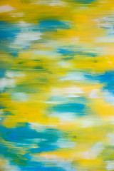 Gelber und blauer Hintergrund aus Pinselstrichen auf Leinwand