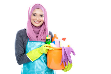 housewife wearing hijab holding bucket full of cleaning supplies