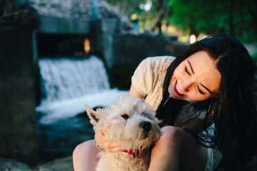 girl playing with a dog