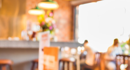 Coffee shop blur background with bokeh image .