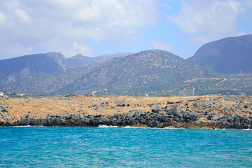 The shores of the Aegean Sea and mountains.