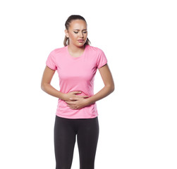 Fototapeta premium beautiful young sportswoman has a pain in her stomach