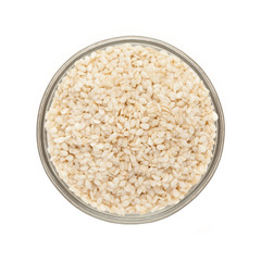 Top view of Organic Sesame white (Sesamum indicum) in glass bowl isolated on white background.