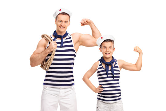 Man and a child in sailor uniforms showing biceps