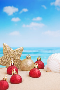 Christmas decorations on the beach, ocean in the back