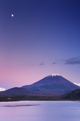 Fototapeta na wymiar Moon over Mount Fuji and Lake Motosu in Japan