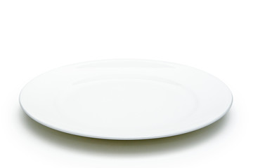 Empty white plate on sack background.