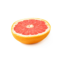 Single ripe grapefruit cut in half isolated over the white