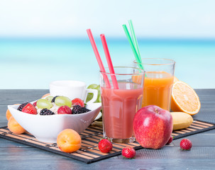 Fresh juice on wooden table 