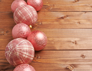 Christmas balls over the wooden background