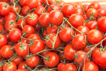 Ripe red cherry tomatoes on the market close up