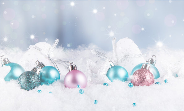 Christmas background with blue baubles,snow and snowflakes, free space for text. Christmas decoration. 