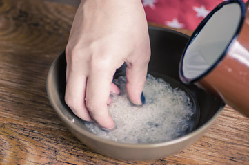 Fototapeta na wymiar Woman washing in water rice