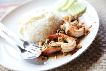 Sea food with basil and egg served with rice