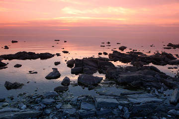 Fototapeta na wymiar Sundown at Rock coast, Lake Baikal, Russia