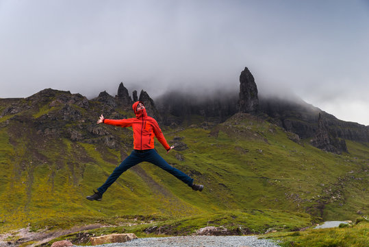 Man Jumping, Looking At The Old Man Of Storr, Scotland