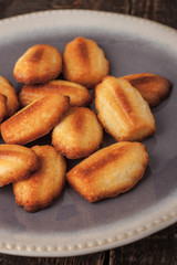 Madeleine cookies on the ceramic plate