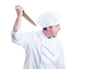 Angry mad chef holding a big knife and shouting