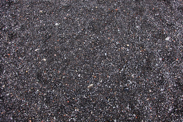 Wet black pebbles Beach of Reynisfjara, Iceland