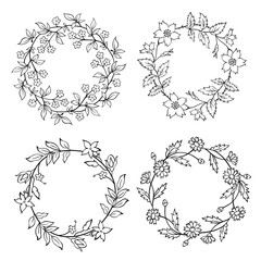 Hand drawn set of four tiny flower wreaths