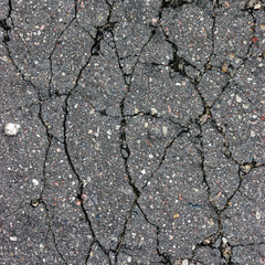 Obraz premium Old aged weathered cracked tarmac texture large detailed damaged asphalt macro closeup 