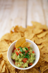 Cup with guacamole and chips