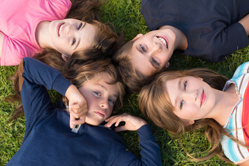 Kids lying on grass