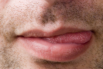 Male mouth showing tongue