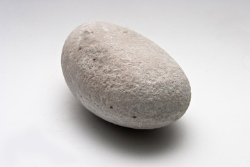Fototapeta na wymiar Decorative stone isolated on white studio background - macro shot, shallow depth of field