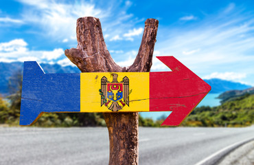 Moldova Flag wooden sign with road background