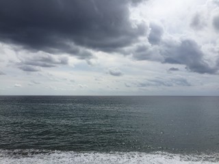 Grey sky reflects in the grey sea