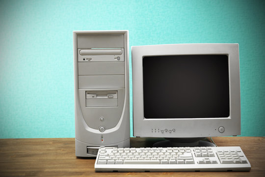 Fototapeta Obsolete computer set on light blue background