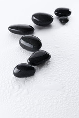 Wet spa stones isolated on white